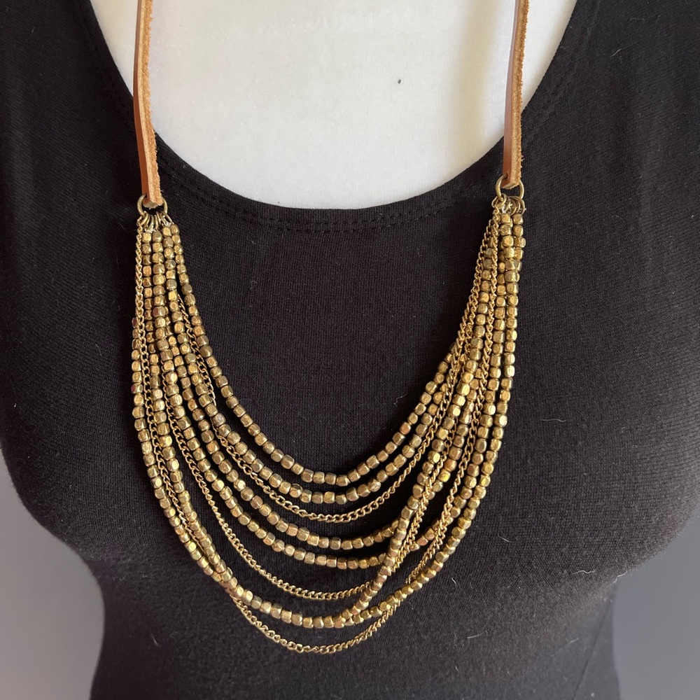 Leather and brushed gold beads necklace